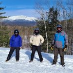 Maine Marine Trades Volunteers snowmobiling to collect canoes in the Katahdin region of Maine